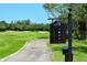A scenic view of the Longboat Key Club golf course with manicured greens and a paved cart path at 3070 Grand Bay Blvd # 644, Longboat Key, FL 34228