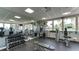 Well-equipped gym with various machines, free weights, and natural light from large windows at 3070 Grand Bay Blvd # 644, Longboat Key, FL 34228