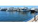 A sunny day at the harbor with luxury yachts docked at their slips, showcasing waterfront living at 3070 Grand Bay Blvd # 644, Longboat Key, FL 34228