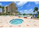 Relaxing community hot tub area next to the pool, with lush landscaping and comfortable seating at 3070 Grand Bay Blvd # 644, Longboat Key, FL 34228