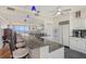 Bright kitchen features white cabinetry, granite countertops and stainless appliances at 3070 Grand Bay Blvd # 644, Longboat Key, FL 34228