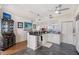 Bright kitchen features white cabinetry, granite countertops, stainless appliances and views at 3070 Grand Bay Blvd # 644, Longboat Key, FL 34228