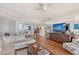Open-concept living room featuring a comfortable sofa, stylish decor, and plenty of natural light at 3070 Grand Bay Blvd # 644, Longboat Key, FL 34228