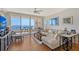 Bright living room featuring sliding glass doors to the balcony and comfortable seating arrangements at 3070 Grand Bay Blvd # 644, Longboat Key, FL 34228
