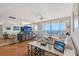 Bright living room featuring sliding glass doors to the balcony and comfortable seating arrangements at 3070 Grand Bay Blvd # 644, Longboat Key, FL 34228