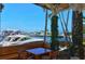 Picturesque outdoor dining area with serene views of the marina and beautiful yachts at 3070 Grand Bay Blvd # 644, Longboat Key, FL 34228
