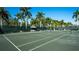 Well-kept tennis court with views of palm trees and tropical landscaping around the property at 3070 Grand Bay Blvd # 644, Longboat Key, FL 34228