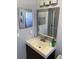 Bathroom with vanity sink and mirror, offering ample lighting and a modern aesthetic at 3231 Cambridge Dr, Sarasota, FL 34232