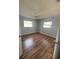 Spacious bedroom features hard surface floors and is illuminated by two windows at 3231 Cambridge Dr, Sarasota, FL 34232