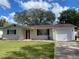 Charming single-story home with a well-manicured lawn and classic curb appeal at 3231 Cambridge Dr, Sarasota, FL 34232