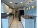 Modern kitchen featuring granite countertops, pendant lighting, and updated stainless steel appliances at 3231 Cambridge Dr, Sarasota, FL 34232