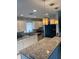 Modern kitchen featuring granite countertops, pendant lighting, and updated stainless steel appliances at 3231 Cambridge Dr, Sarasota, FL 34232