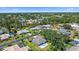 Aerial view of the community with lush landscaping, golf course and several small lakes at 3335 Meadow Run Ter, Venice, FL 34293