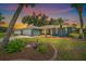 Charming single-story home with a well-maintained lawn and lovely landscaping at 3335 Meadow Run Ter, Venice, FL 34293
