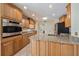 This kitchen features granite countertops, wood cabinets and stainless steel appliances at 3335 Meadow Run Ter, Venice, FL 34293