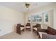 Sunroom featuring a ceiling fan, and light beige paint at 3335 Meadow Run Ter, Venice, FL 34293