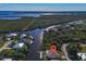 Wide aerial shot featuring a home located on a canal leading to a large body of water at 3620 Como St, Port Charlotte, FL 33948