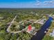 Wide aerial captures a canal-front home set among winding canals and lush trees at 3620 Como St, Port Charlotte, FL 33948