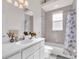 Well-lit bathroom featuring a bath/shower, toilet, and vanity with a white countertop at 3620 Como St, Port Charlotte, FL 33948