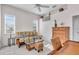 Bedroom area featuring a cozy futon, a desk and natural light from nearby windows at 3620 Como St, Port Charlotte, FL 33948