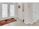 Bright foyer with tile flooring, a decorative rug, and a double-door entrance to the home at 3620 Como St, Port Charlotte, FL 33948