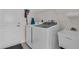 Functional laundry room with a washer, dryer, sink, and storage, for efficient chore management at 3620 Como St, Port Charlotte, FL 33948