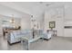 Open-concept living room with tiled flooring and a comfortable sectional sofa, adjacent to the dining area at 3620 Como St, Port Charlotte, FL 33948