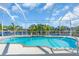 Relaxing pool area featuring a sparkling pool, waterfront views, and lush tropical landscaping at 3620 Como St, Port Charlotte, FL 33948
