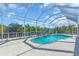 A beautiful screened pool and patio area with stunning views of the waterway at 3620 Como St, Port Charlotte, FL 33948