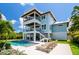 Inviting backyard features a refreshing pool, patio seating, and stylish landscaping at 3702 5Th Ave, Holmes Beach, FL 34217