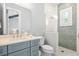 This bright bathroom features a glass shower, a modern vanity, and recessed lighting at 3702 5Th Ave, Holmes Beach, FL 34217