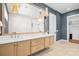 This bathroom features a large vanity with dual sinks, modern fixtures, and a walk-in shower at 3702 5Th Ave, Holmes Beach, FL 34217