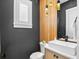 This half bathroom features a custom vanity with a vessel sink, modern fixtures, and recessed lighting at 3702 5Th Ave, Holmes Beach, FL 34217