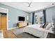 This primary bedroom features beautiful wood floors, a walk-out balcony, and an ensuite bathroom at 3702 5Th Ave, Holmes Beach, FL 34217