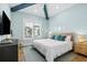This bedroom features a bright window, hardwood floors, recessed lighting, and coastal decor at 3702 5Th Ave, Holmes Beach, FL 34217