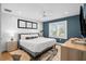 Inviting bedroom featuring a ceiling fan, soft lighting, and a comfortable bed with a patterned rug at 3702 5Th Ave, Holmes Beach, FL 34217
