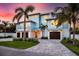 Beautiful two-story coastal home with well-manicured lawn and paver driveway at 3702 5Th Ave, Holmes Beach, FL 34217