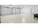 Spacious two car garage featuring epoxy floor and white walls at 3702 5Th Ave, Holmes Beach, FL 34217
