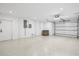 Spacious garage with epoxy floor, white walls, and automatic door at 3702 5Th Ave, Holmes Beach, FL 34217