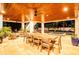 Spacious covered patio with dining, seating areas, and view of the pool at 3702 5Th Ave, Holmes Beach, FL 34217