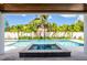 Stunning pool and spa area surrounded by lush tropical landscaping, offering a private outdoor retreat at 3702 5Th Ave, Holmes Beach, FL 34217