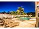 A backyard in-ground pool with lounge chairs at 3702 5Th Ave, Holmes Beach, FL 34217