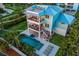 Beautiful outdoor area with pool, spa, balconies and lounge chairs at 3702 5Th Ave, Holmes Beach, FL 34217