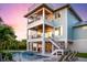Three story home with balconies, outdoor kitchen and in-ground pool at 3702 5Th Ave, Holmes Beach, FL 34217