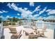 Relaxing rooftop deck features comfortable seating and beautiful views of the neighborhood at 3702 5Th Ave, Holmes Beach, FL 34217