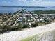 Stunning aerial view of the coastal property near the beach, showcasing its prime location and scenic surroundings at 3703 5Th Ave # 3, Holmes Beach, FL 34217
