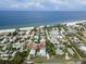 The property is shown in an aerial view, positioned near a stunning beach and a charming neighborhood at 3703 5Th Ave # 3, Holmes Beach, FL 34217