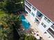 Aerial view featuring a shared pool, patio, and loungers at 3703 5Th Ave # 3, Holmes Beach, FL 34217