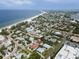 A bird's eye view of the property highlighting proximity to a beach and nearby residential area at 3703 5Th Ave # 3, Holmes Beach, FL 34217
