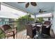 Inviting balcony with ample seating, ceiling fans, and views of lush tropical landscaping at 3703 5Th Ave # 3, Holmes Beach, FL 34217